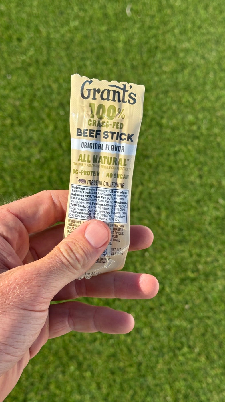 Beef Sticks — held up over the pasture